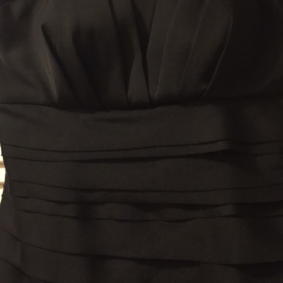 Black cocktail dress size 8. Has optional belt.